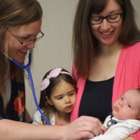 mother with kids and doctor